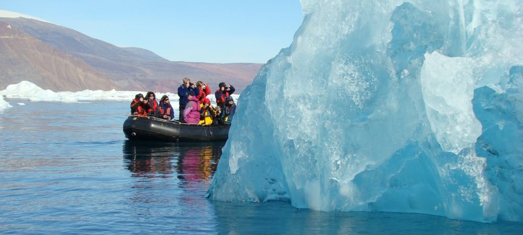 Zodiac cruising among massive icebergs_Christoph Gouraud